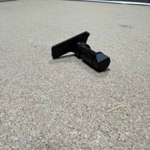 Sig Sauer P320 Oem Stock Takedown Lever Tcm Stock 2 Sig Sauer P320 OEM stock takedown lever on textured surface for secure handling.
