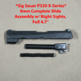 Sig Sauer P320 9mm slide assembly with barrel and night sights for precision shooting.