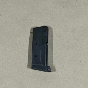Sig Sauer P365 10-round magazine with pinky extension for enhanced grip and performance.
