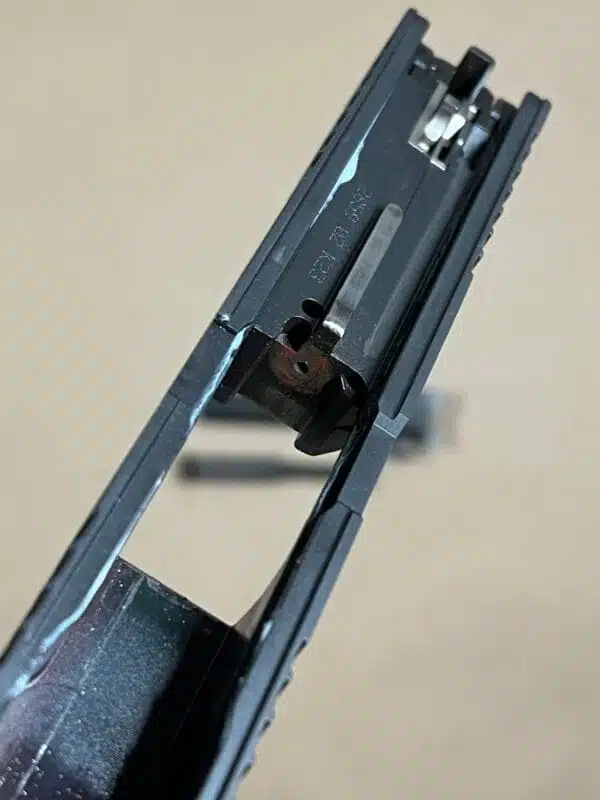 Detailed view of the Sig Sauer P320 9mm complete slide assembly with night sights.
