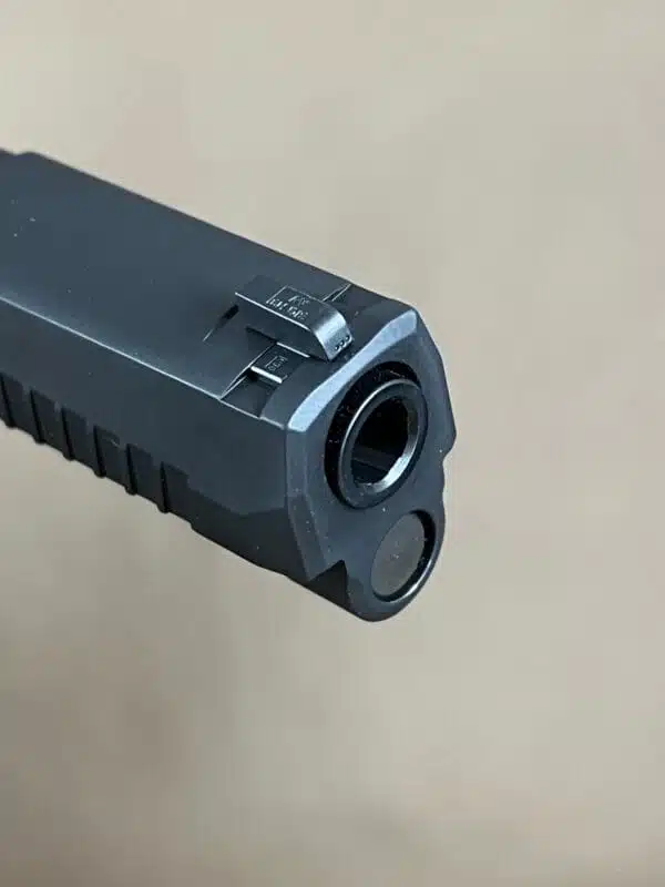Sig Sauer P320 9mm slide assembly with night sights, optic-ready design for compact use.