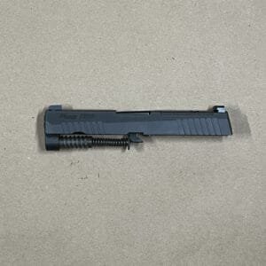 Sig Sauer P320 9mm slide assembly with night sights, optic-ready for compact firearms.