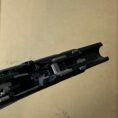Glock 17 Gen 3 lower frame with factory parts and TCM stock, showcasing precision engineering.
