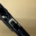 Glock 48 and 43X OEM factory lower frame parts detailed in close-up view.