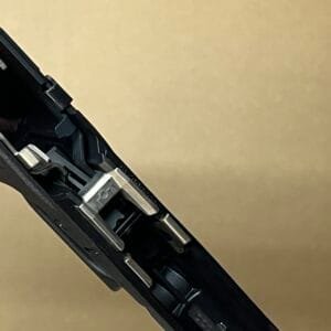 Glock 48 and 43X OEM factory lower frame parts detailed in close-up view.