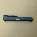 Glock 48 OEM slide assembly with barrel and recoil spring in black, ideal for upgrades.