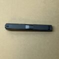 Glock 48 OEM upper assembly slide, barrel, and recoil spring in sleek black finish.