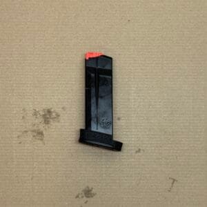 Black 13-round Smith & Wesson MP9 Shield Plus OEM magazine with an orange tip for safety.