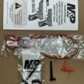 Smith & Wesson MP9 M20 full-size OEM metal lower frame with TCM stock accessories.