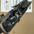 Close-up of Smith & Wesson MP9 M20 metal lower frame showcasing internal mechanisms and design.