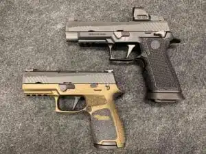 Handgun comparison featuring modern Tcm stock designs on a textured gray surface.