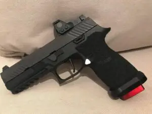 Sleek modern pistol with a red dot sight designed for precision and tactical use.