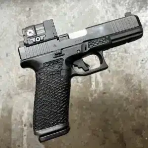 Modern Glock pistol with optical sight and TCM stock for precision shooting and personal defense.