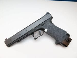 Sleek modern handgun with tactical rail and extended magazine for enhanced performance and efficiency.