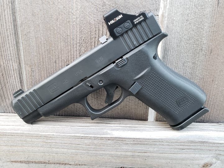 Sleek Glock 48 pistol with red dot sight, perfect for everyday carry and precision shooting.